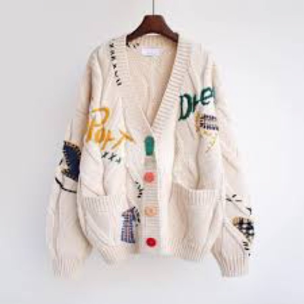 Stylish Cream Sweater with Colorful Accents